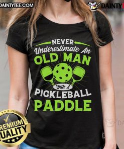 Funny graphic tee featuring 'Never Underestimate An Old Man With A Pickleball Paddle' for ladies, perfect for pickleball fans.