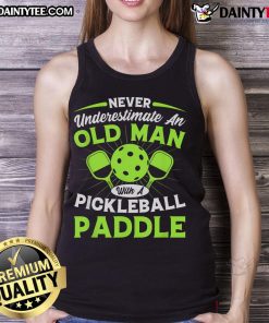 Old man confidently holding a pickleball paddle, wearing a stylish 'Never Underestimate' tank top, ready for the game.