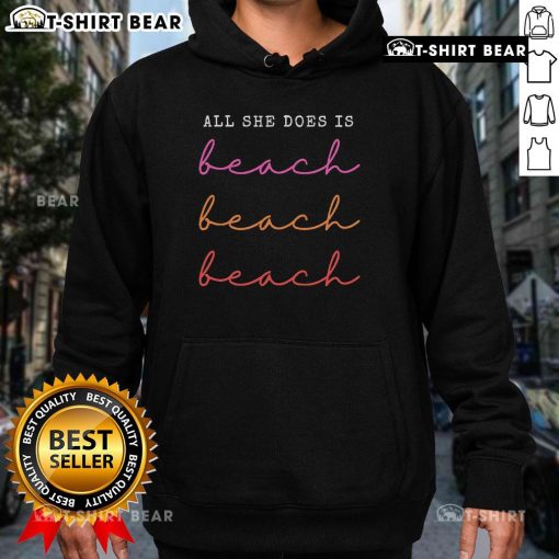 Cozy 'Top All She Does Is Beach Repeat Hoodie' in sunny beach setting, perfect for beach lovers and casual wear.