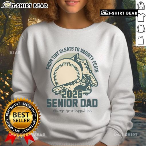 Alt Text: Top Baseball Senior Dad 2026 sweatshirt featuring tiny cleats and varsity feats design for proud baseball parents.