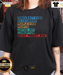 Top Democracy Over Dictatorship graphic on a ladies tee, promoting justice, people over profits, and resistance.