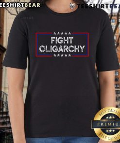 Activist ladies wearing 'Top Fight Oligarchy, Stand Against Corporate Greed' tees, promoting social justice and awareness.