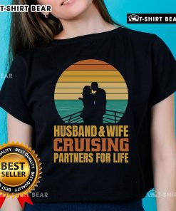 Couple enjoying a sunset cruise, wearing matching vintage tees: 'Top Husband and Wife Cruising Partners for Life'.