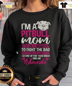 Pitbull mom wearing a sweatshirt advocating against stereotypes and bad reputations of Pitbulls.