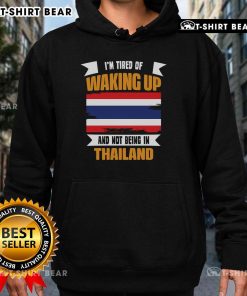 Alt Text: Cozy hoodie featuring the phrase 'I'm Tired of Waking Up and Not Being in Thailand' perfect for travel enthusiasts.
