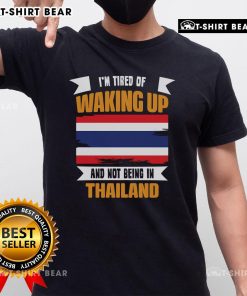 Alt Text: Top I'M Tired Of Waking Up And Not Being In Thailand T-Shirt design featuring vibrant graphics and travel-inspired theme.