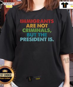 Top immigrants are not criminals but the president is ladies tee, featuring bold text on a stylish women's t-shirt design.