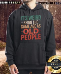 Cozy hoodie featuring the phrase 'It's Weird Being the Same Age as Old People' for a humorous fashion statement.