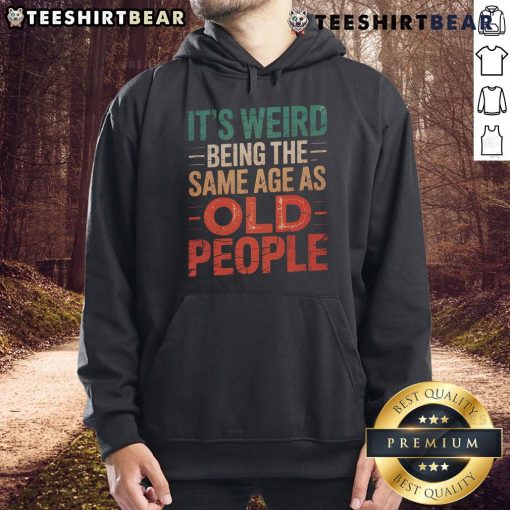 Cozy hoodie featuring the phrase 'It's Weird Being the Same Age as Old People' for a humorous fashion statement.