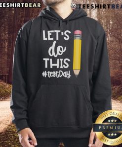 Teacher wearing a motivational hoodie for state testing, promoting positivity with 'Let's Do This Test Day' message.