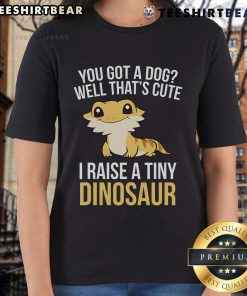 Bearded dragon on a ladies tee, showcasing a fun 'I Raise A Tiny Dinosaur' design featuring lizards and geckos.