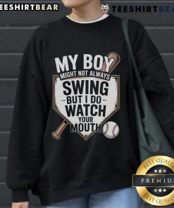 Alt Text: Top My Boy Might Not Always Swing Baseball Sweatshirt featuring a playful design, perfect for sports enthusiasts.