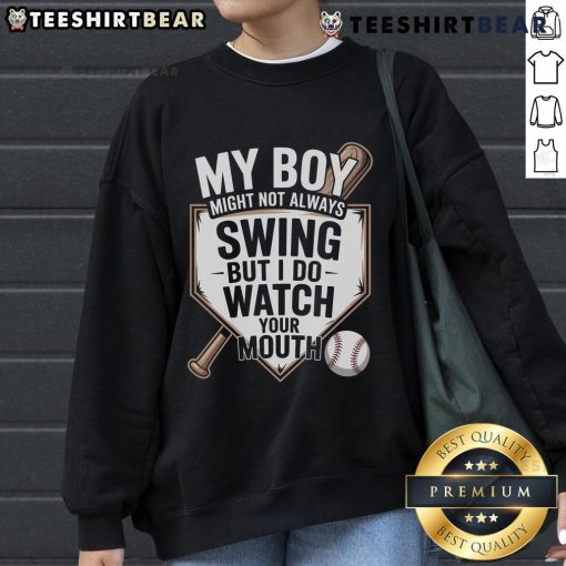 Alt Text: Top My Boy Might Not Always Swing Baseball Sweatshirt featuring a playful design, perfect for sports enthusiasts.