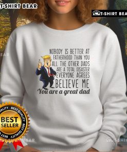 Donald Trump sweatshirt featuring 'Nobody Is Better At Fatherhood' slogan, perfect for proud dads and Trump supporters.