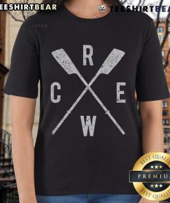 Alt Text: Top rowing crew with crossed oars, ladies scull team in action with coach, showcasing teamwork and athleticism.