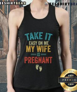 Vintage tank top featuring 'Take It Easy On Me, My Wife Is Pregnant' design, perfect for expecting dads.