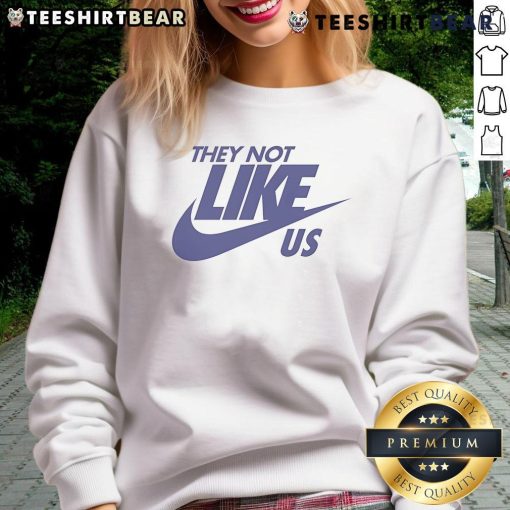Stylish Top-They-Not-Like-Us Nike sweatshirt in black, perfect for casual wear and street style enthusiasts.