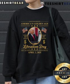 Alt Text: Top Trump reading tariffs on a 'Liberation Day' sweatshirt, celebrating fair trade in a golden age of commerce.
