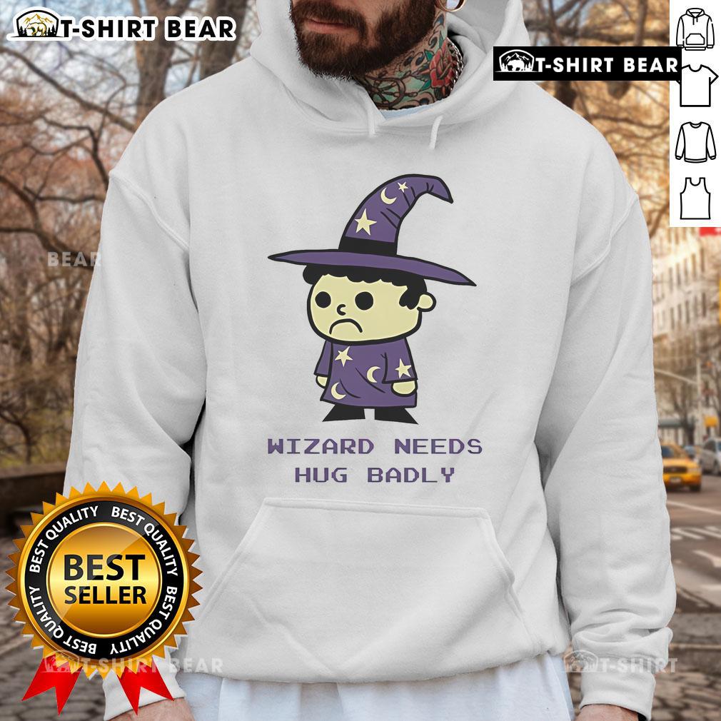 Top Wizard Needs Hugs Badly Hoodie Cozy Top Wizard Needs Hugs Badly Hoodie featuring a whimsical design, perfect for fans of magic and comfort.