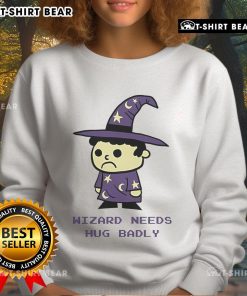 Cozy Top Wizard Needs Hugs Badly Sweatshirt featuring a whimsical design, perfect for magic lovers and comfort seekers.