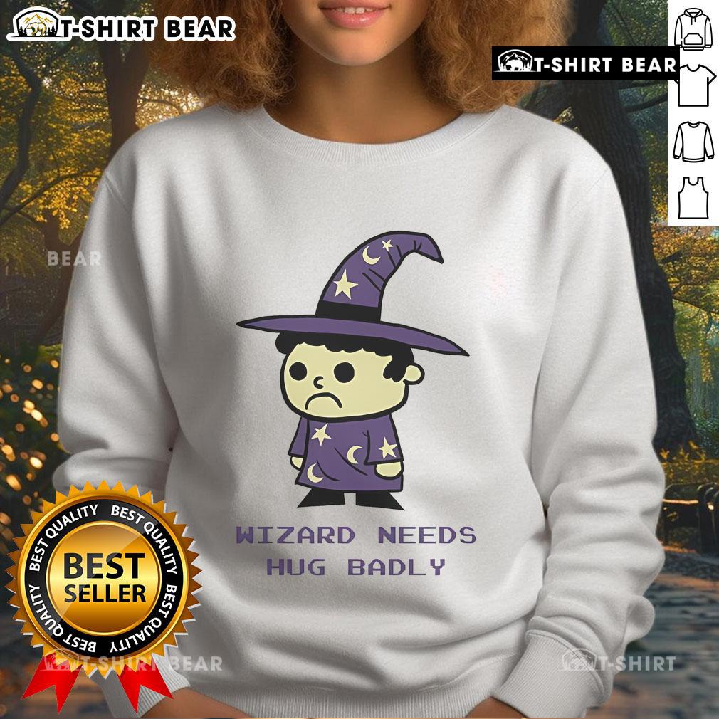 Top Wizard Needs Hugs Badly Sweatshirt Cozy Top Wizard Needs Hugs Badly Sweatshirt featuring a whimsical design, perfect for magic lovers and comfort seekers.