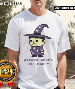 Top Wizard Needs Hugs Badly T-Shirt featuring a whimsical graphic of a wizard asking for hugs in vibrant colors.
