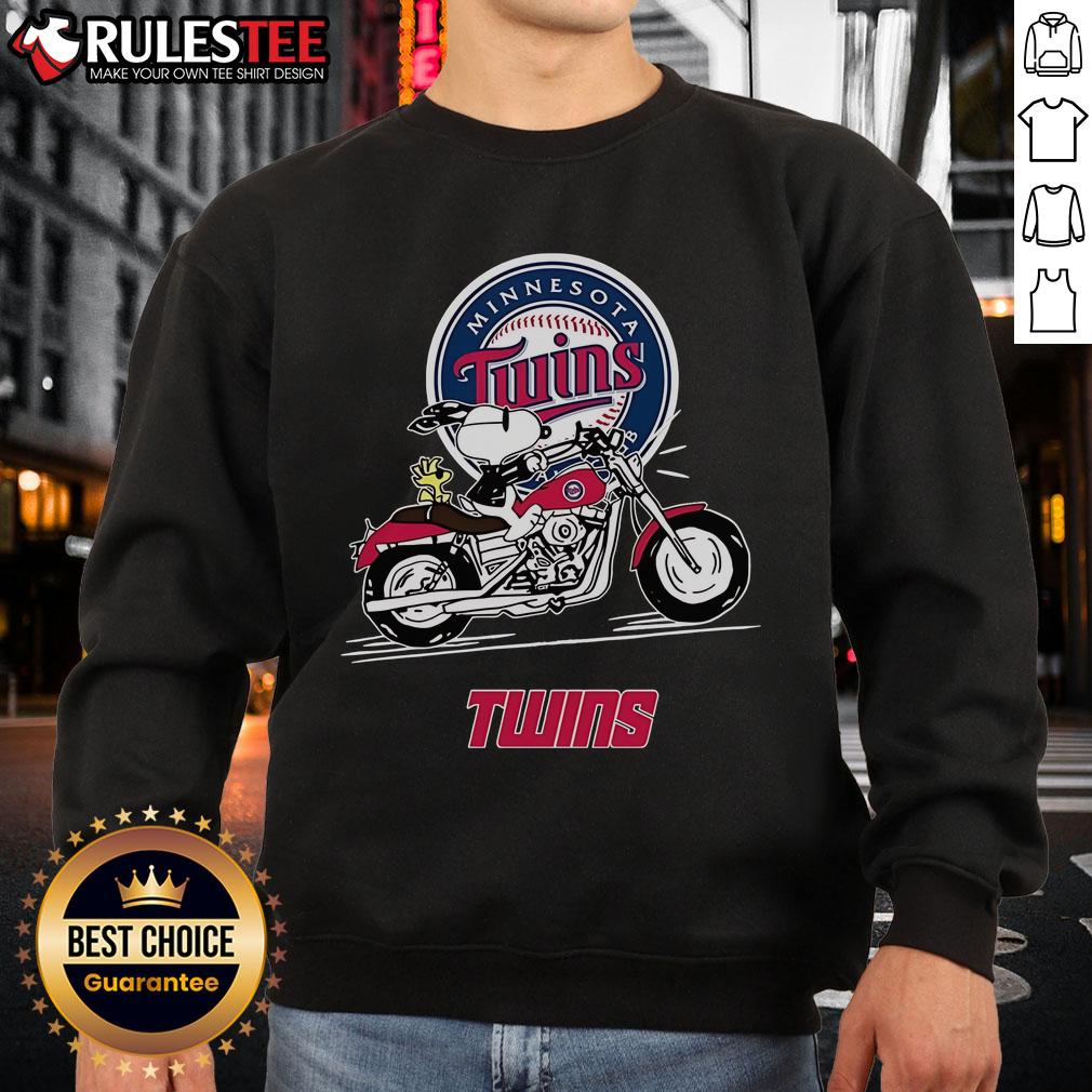 Awesome Snoopy And Woodstock Driving Motorbike Minnesota Twins Sweatshirt Snoopy and Woodstock riding a motorbike on a Minnesota Twins sweatshirt, showcasing a fun and vibrant design.