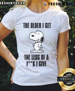 Awesome Snoopy tee for ladies featuring 'The Older I Get, The Less of a F*ck I Give' design, perfect for casual wear.