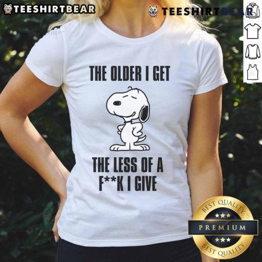 Awesome Snoopy tee for ladies featuring 'The Older I Get, The Less of a F*ck I Give' design, perfect for casual wear.