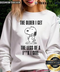Awesome Snoopy sweatshirt featuring 'The Older I Get, The Less Of A Fck I Give' in a fun design for casual wear.