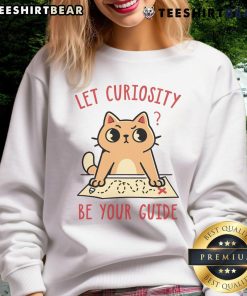 Adorable cat on a sweatshirt with 'Let Curiosity Be Your Guide' text, perfect for cat lovers and cozy fashion.