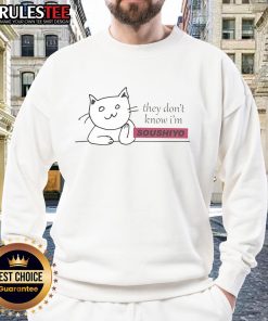 Cute cat wearing a 'They Don't Know I'm Soushiyo' sweatshirt, showcasing playful charm and cozy style.