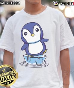 Cute penguin standing on an ice floe, featured on a trendy T-shirt design perfect for animal lovers and winter fashion.