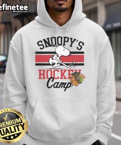 Alt Text: Cute Snoopy wearing a Chicago Blackhawks Snoopy's Camp hoodie, perfect for fans and cozy winter days.