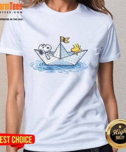 Alt Text: Cute Snoopy sailing in a paper boat on a ladies tee, perfect for fans of whimsical and playful graphic shirts.