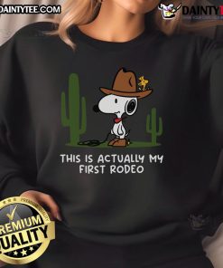 Alt Text: Cute Snoopy This Is Actually My First Rodeo sweatshirt featuring vibrant colors and playful design for fans.