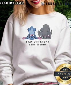 Alt Text: Cute Stitch and Toothless design on a sweatshirt with Stay Different, Stay Weird slogan, perfect for unique style.