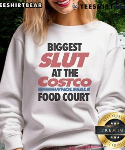 Funny sweatshirt reading 'Biggest Slut at the Costco Wholesale Food Court' displayed on a model at a food court.