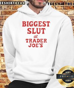 Funny 'Biggest Slut at Trader Joe's' hoodie displayed in a grocery store, showcasing a humorous design and vibrant colors.