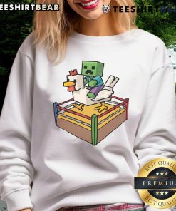 Funny Fighting Chicken Minecraft Chicken Jockey Sweatshirt featuring a vibrant design of a chicken riding a player.