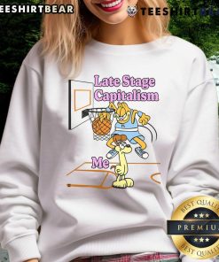 Funny Last Stage Capitalism Garfield vs Odie basketball sweatshirt featuring vibrant graphics and playful design.