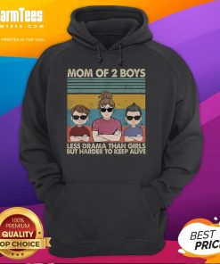 Alt Text: Funny mom of 2 wearing a vintage hoodie, highlighting the humor in raising boys vs. girls with less drama.