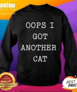 Funny 'Oops I Got Another Cat' sweatshirt featuring a playful cat graphic, perfect for cat lovers and humor enthusiasts.
