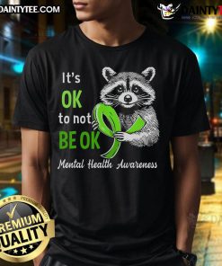 Funny raccoon graphic on a It's Okay To Not Be Okay mental health awareness T-shirt promoting positivity and self-acceptance.