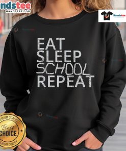 Vintage sweatshirt featuring 'Good Eat Sleep School Repeat' design, perfect for back-to-school style.