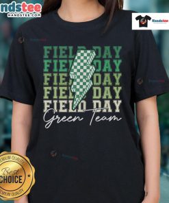 Good Field Day Green Team ladies participating in a fun field trip game, showcasing team spirit in vibrant green tees.