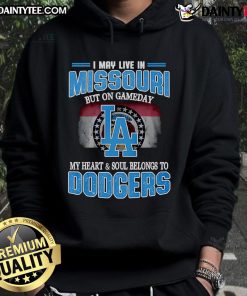 Person wearing Dodgers hoodie, showcasing pride for the team while living in Missouri on game day.