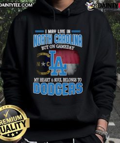 Person wearing a Dodgers hoodie in North Carolina, showcasing team pride on game day with a vibrant background.