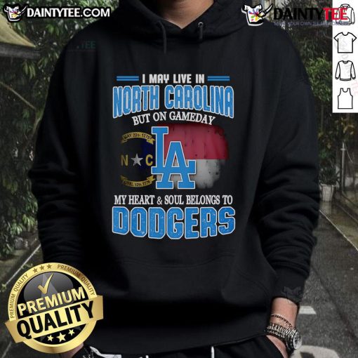 Person wearing a Dodgers hoodie in North Carolina, showcasing team pride on game day with a vibrant background.