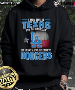 Person wearing a Dodgers hoodie, showcasing pride for the team, despite living in Texas on game day.